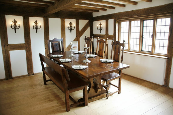 Handmade Lyre End Oak Table with chairs and bench in an English Hall House