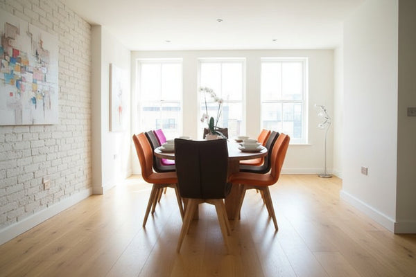 Handmade Sussex Oval dining table with 4 column base in London apartment