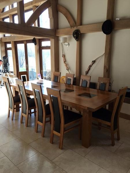 Oakstone oak table in a home vineyard setting with heavy beams