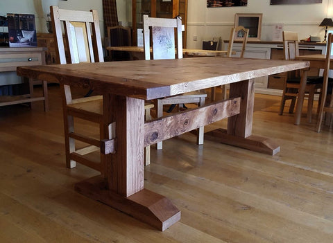 Handmade oak trestle Pillar dining table in Country Ways Oak Furniture showroom in Sussex