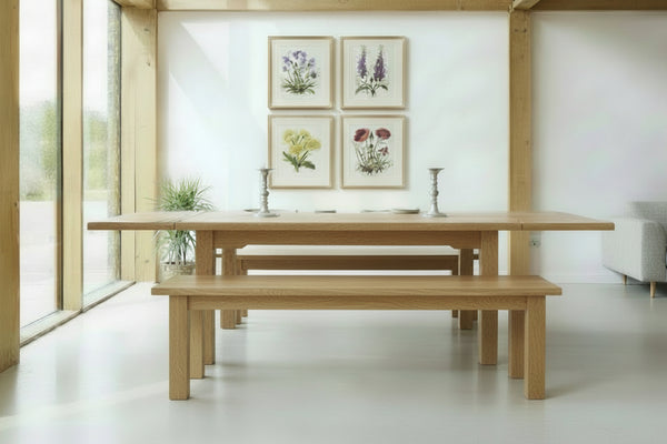 Handmade Sussex Boarded oak refectory dining table in a modern oak framed dining room with handmade oak benches to match