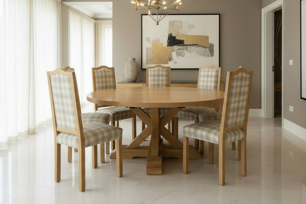 Handmade Swailes round oak dining table with handmade upholstered Swailes chairs