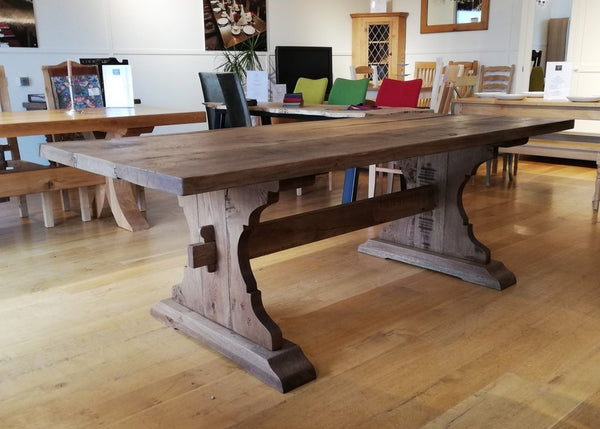 Lyre End oak table side view in our furniture showroom