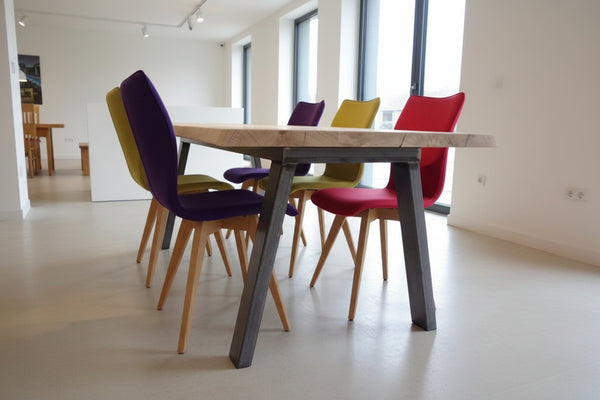 Quadpod chairs with handmade waney live edge oak and steel dining table