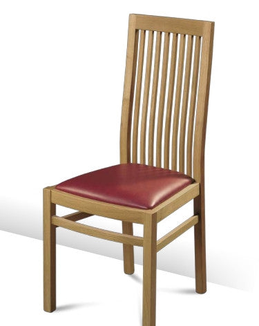 A contemporary slatted back oak chair with a leather seat pad in red.