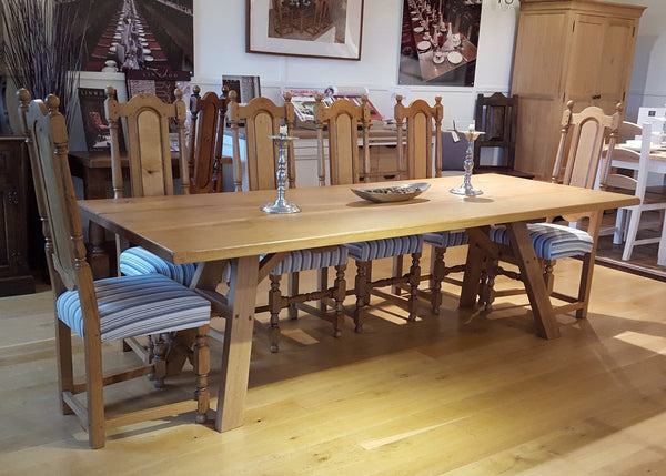 Handmade A-frame splayed leg oak dining table in Country Ways Oak furniture showroom