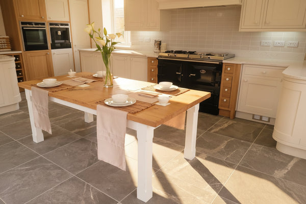 Boarded Oak Refectory Dining Table With Painted Base in a painted kitchen with a large aga