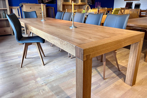 Tuscany extending Terra oak dining table with Quadpod leather chairs